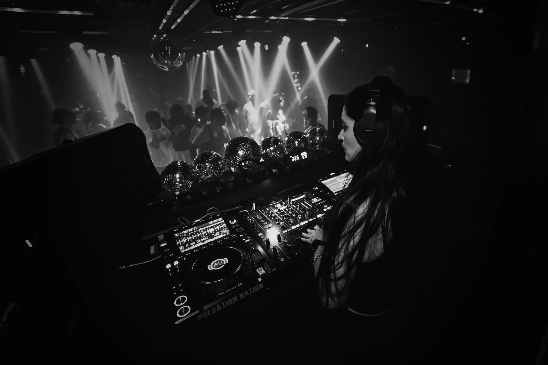 View from behind Susie Otto at a crowded club performance